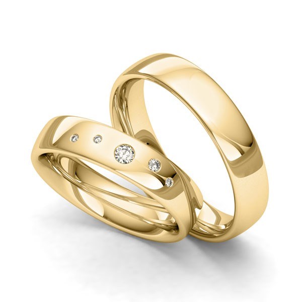 Siersbøl vielsesringe i guld med stjernedrys og 0,08 ct brillanter i elegant design