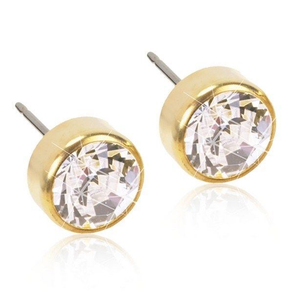Blomdahl golden titanium øreringe med klar zirkonia i bezel-fatning, fås i Ø3-6 mm