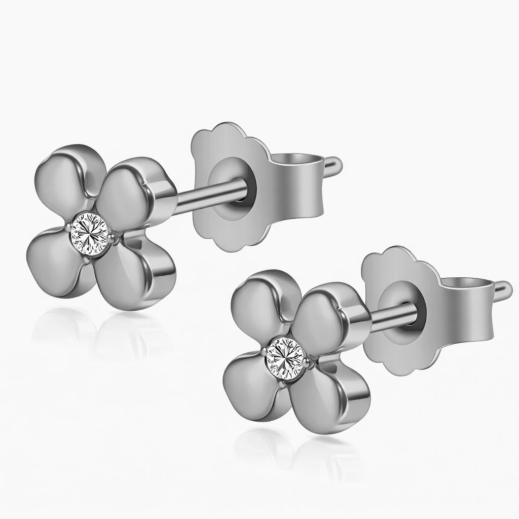 Blomsterøreringe i rent titanium med klar zirkonia i midten