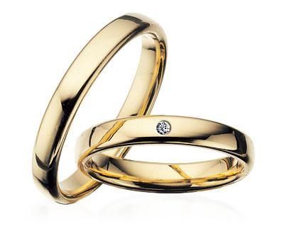 Scrouples vielsesring i guld med diamant – nærbillede af sten