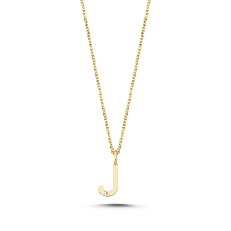 Nuran bogstav vedhæng i 14 kt guld med diamant – nærbillede af fatning