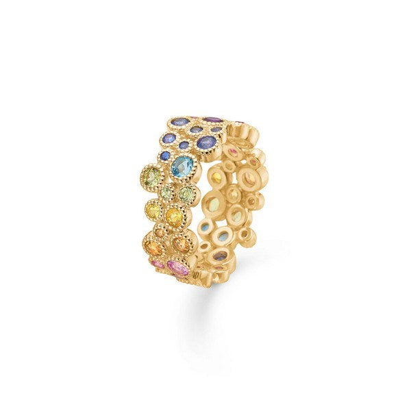 Mads Z Luxury Rainbow ring i 14 karat guld med ametyst, rubin og safir – liggende på flade