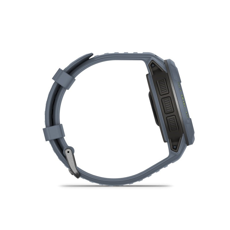 Garmin Instinct Crossover Solar herreur i Blue Granite – robust smartwatch med solcelleopladning, liggende på flade