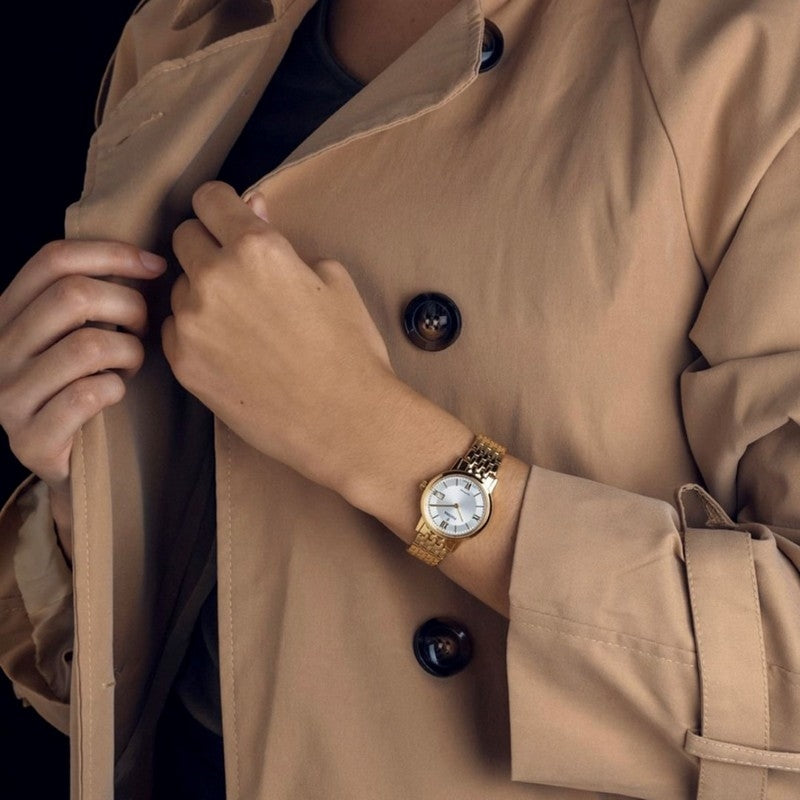 Festina dameur i gulddouble med hvid skive og Swiss Made kvartsværk, set fra siden